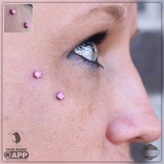 a woman's face with pink dots on her cheek and nose, as well as an eyelid shot