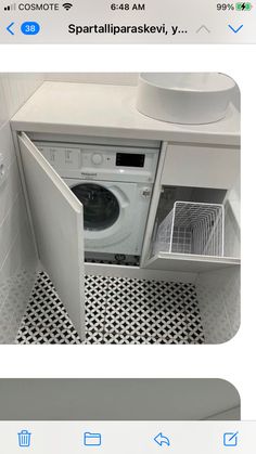 an appliance that is open to show the washing machine