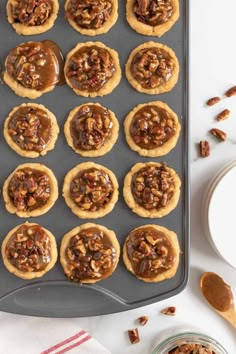 chocolate pecan cookies are lined up on a cookie sheet and ready to be baked