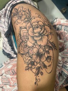 a woman's arm with flowers on it