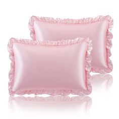 two pink pillows with ruffled edges on white background, one is light pink and the other is dark pink