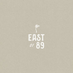 the words east or 89 are written in white on a light gray background with a small flower