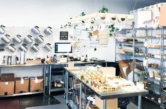 a room filled with lots of boxes and shelves next to each other on metal racks