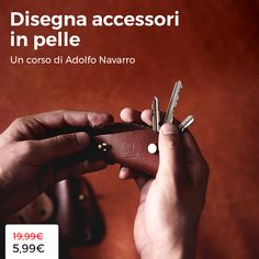 a hand holding a wallet with keys in it and the words disegan accessori in pelle