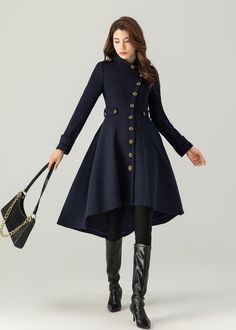 "FEATURES 50% wool, 50% wool blend Fully liner with polyester  With pockets Banded neckline Long sleeve Button closure in front Fitted waist Irregualr hemline For Winter, Autumn Navy blue wool coat Asymmetrical wool coat dry clean ★★Mode size Height 170cm (5′ 7″)  Bust 84 cm (33\")  Waist 66 cm (26\")  She wears size XS. ★★Bespoke Order Service If you Request other color Request the length Your height is not between 155 cm- 175 cm Your weight is not between 47 kg -77 kg I can do it for you, It w Navy Winter Dress, Asymmetrical Single Breasted Fall Outerwear, Asymmetrical Single Breasted Outerwear For Fall, Asymmetrical Single-breasted Outerwear For Fall, Asymmetrical Single-breasted Fall Outerwear, Winter Workwear Outerwear With Asymmetrical Hem, Asymmetrical Hem Outerwear For Winter Workwear, Fall Workwear Outerwear With Asymmetrical Hem, Fall Outerwear With Asymmetrical Hem For Work