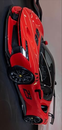 a red sports car is shown from above