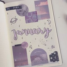 an open notebook with the word january written in cursive writing, surrounded by other items