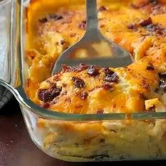 a casserole dish is shown with a serving spoon in the casserole