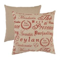 two pillows with the names of different countries on them, one red and one beige