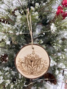 a wooden ornament hanging from a christmas tree