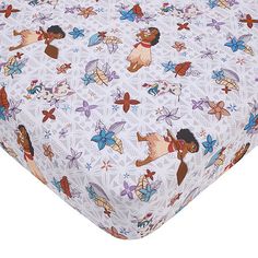 an image of a baby bed sheet with cartoon characters on it's coverlet