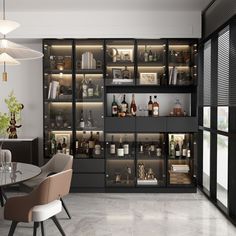 a room filled with lots of bottles and shelves next to a dining table in front of a window