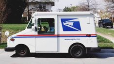 an postal truck with the words package delivery written on it's side and in front