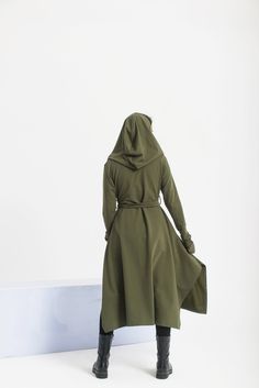 "Comfy and soft hooded maxi cardigan featuring two side pockets, a long belt, and a comfy hood. The model in the picture is 170cm. ⅼ 5.7 ft. tall and is wearing size XS/Color: Military Green 🌟 INFO: * Worldwide EXPRESS shipping - please provide a phone number for shipping documents * US Sizing XS to 4XL - body size chart available below * We offer customization to Personal Measurements & Larger Sizes 5XL, 6XL, 7XL .... 🌟 MATERIAL & CARE * fabric: cotton mix * hand wash * cold water 30 degrees * iron at medium temperature 🌟 🌟 🌟 SIZE CHART 🌟 🌟 🌟 SIZE XS Bust: around 33.5\" / 85cm Waist: around 26\" / 66cm Hips: around 36\" / 91 cm SIZE S Bust: around 35.5\" / 90 cm Waist: around 28\"/ 71 cm Hips: around 38\"/ 97 cm SIZE M Bust: around 37.5\" / 95 cm Waist: around 30\"/ 76 cm Hips: ar Fall Cotton Outerwear For Cosplay, Green Fall Outerwear For Cosplay, Winter Cotton Outerwear For Cosplay, Green Outerwear For Fall Cosplay, Cotton Hooded Jacket For Winter Cosplay, Elvish Cosplay Outerwear For Fall, Fall Cosplay Hooded Jacket With Drawstring Hood, Winter Cotton Hooded Jacket For Cosplay, Fall Cosplay Outerwear With Drawstring Hood