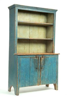 an old blue wooden cabinet with two doors