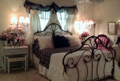 a bedroom with a bed and chandelier in it