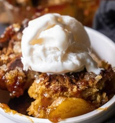 a close up of a plate of food with fruit and ice cream on top,