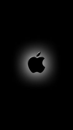 an apple logo is shown in the dark