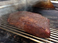 a steak is being cooked on the grill