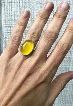 A lovely bright canary yellow agate has been set in sterling silver with a handmade ring band from sterling silver half dome wire. This yellow agate is 20mm x 15mm in size. An easy ring to wear that adds a pop of color to any outfit!Made to order! Each stone will vary slightly in color. Yellow Gemstone Ring, Yellow Agate, Yellow Gemstones, Ring Gifts, Fused Glass Jewelry, Canary Yellow, Agate Ring, Half Dome, Asheville Nc