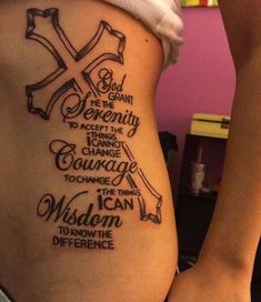 a woman with a cross tattoo on her stomach that says god grant the serenity to accept the change