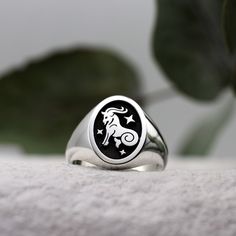 This Zodiac signet ring features a sea-goat on a black background with three twinkling stars. Birthdates - 22nd December - 20th January Element - Earth Capricorn is the tenth sign of the Zodiac and is symbolised the mythical sea-goat. A creature with the forepart of a goat and the tail of a fish.  Characteristics of this star sign include generosity, a strong desire for success and an ability to outlast their problems and overcome limitations.  Solid Sterling Silver Ring Face - 15x11mm Height of Zodiac Jewellery, Sea Goat, Burning Rose, Oval Signet Ring, Rose Jewellery, Astrology Jewelry, Element Earth, Twinkling Stars, A Goat