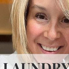 a close up of a person smiling with the words laundry on her shirt in front of them