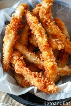 some fried food is in a bowl on a table