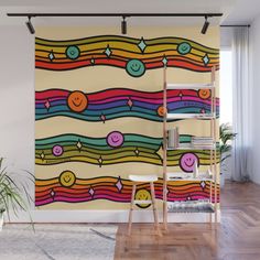 a colorful wall mural with smiley faces on it