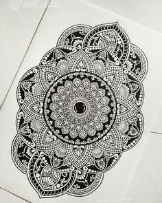 an intricate black and white drawing on paper