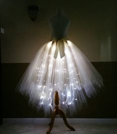 a dress made out of tulle with lights on it