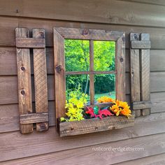 a window that has some flowers in it