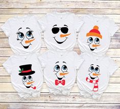 four snowman shirts with hats and sunglasses on them