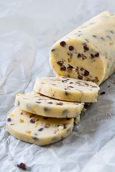 three pieces of chocolate chip ice cream sitting on top of waxed paper next to each other