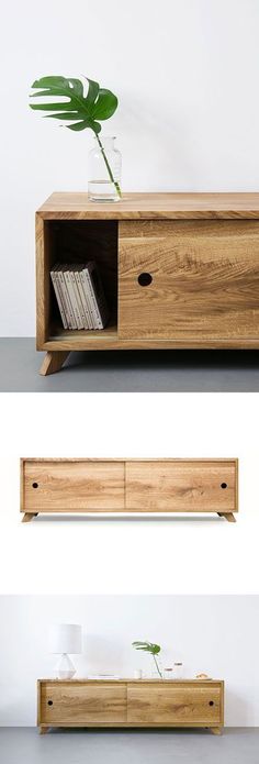 the sideboard is made out of wood and has a plant in it