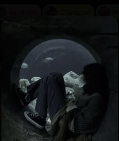 a person laying on the ground in a tunnel