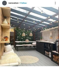 an outdoor kitchen with lots of lights on the ceiling