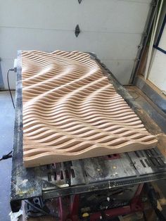 a large piece of wood is being worked on