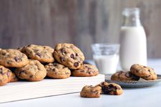 chocolate chip cookies and milk on a table