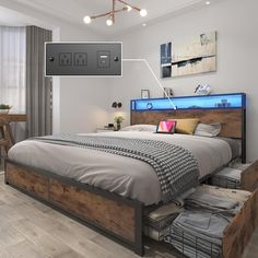 a bed with two drawers underneath it in a room that has white walls and wood floors