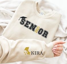 Custom Senior 2025 Sweatshirt, Class of 2025 Sweater ,Shirt with name written on the sleeve, Customize Year, Graduation gifts, Senior Shirts HOW TO ORDER 1 - Please check and review all listing photos. 2 - Please pick your t-shirt/sweatshirt/hoodie type and size. 3 -  Please pick your t-shirt/sweatshirt/hoodie color. 4 - Select the quantity. 5 - Click add to cart. 6 - Please click "Continue to Payment". PRODUCT INFORMATION ⭐ We have a size chart on our listing photos ⭐ All our simple color ones Senior Apparel Design, Senior Sweatshirts Ideas Diy, Senior Hoodie Ideas, Senior Sweaters, Senior Sweatshirts Ideas, Senior Apparel, Senior Hoodies, Senior Year Diy, Senior Year Scrapbook