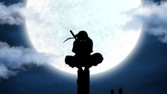 a person sitting on top of a wooden pole in front of a full moon and clouds