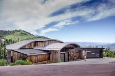 a large wooden building sitting on the side of a road