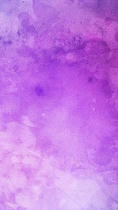 an abstract purple and pink background with watercolor stains