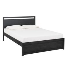 a black bed frame with white sheets and pillows on top of the headboard, in front of a white background