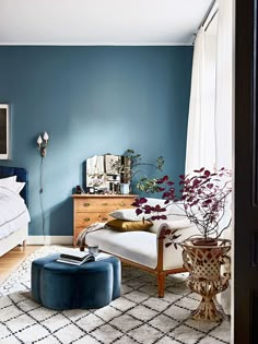 a bedroom with blue walls and furniture in the room is featured on instagrams