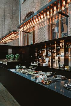 an empty bar with lots of food on the counter