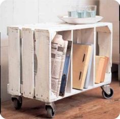 a white cart with some books on top of it