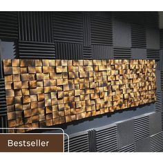 the wall is made out of wood blocks and has been designed to look like an abstract piece