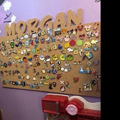 there is a bulletin board with lots of pins on it and the word morgan written in large letters